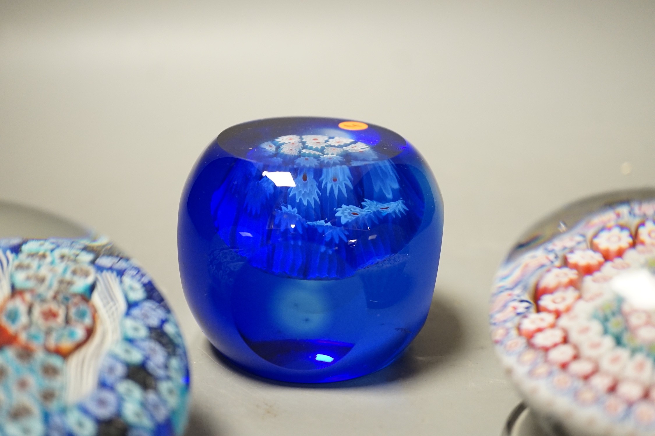 Three millefiori glass paperweights, largest 8cm diameter